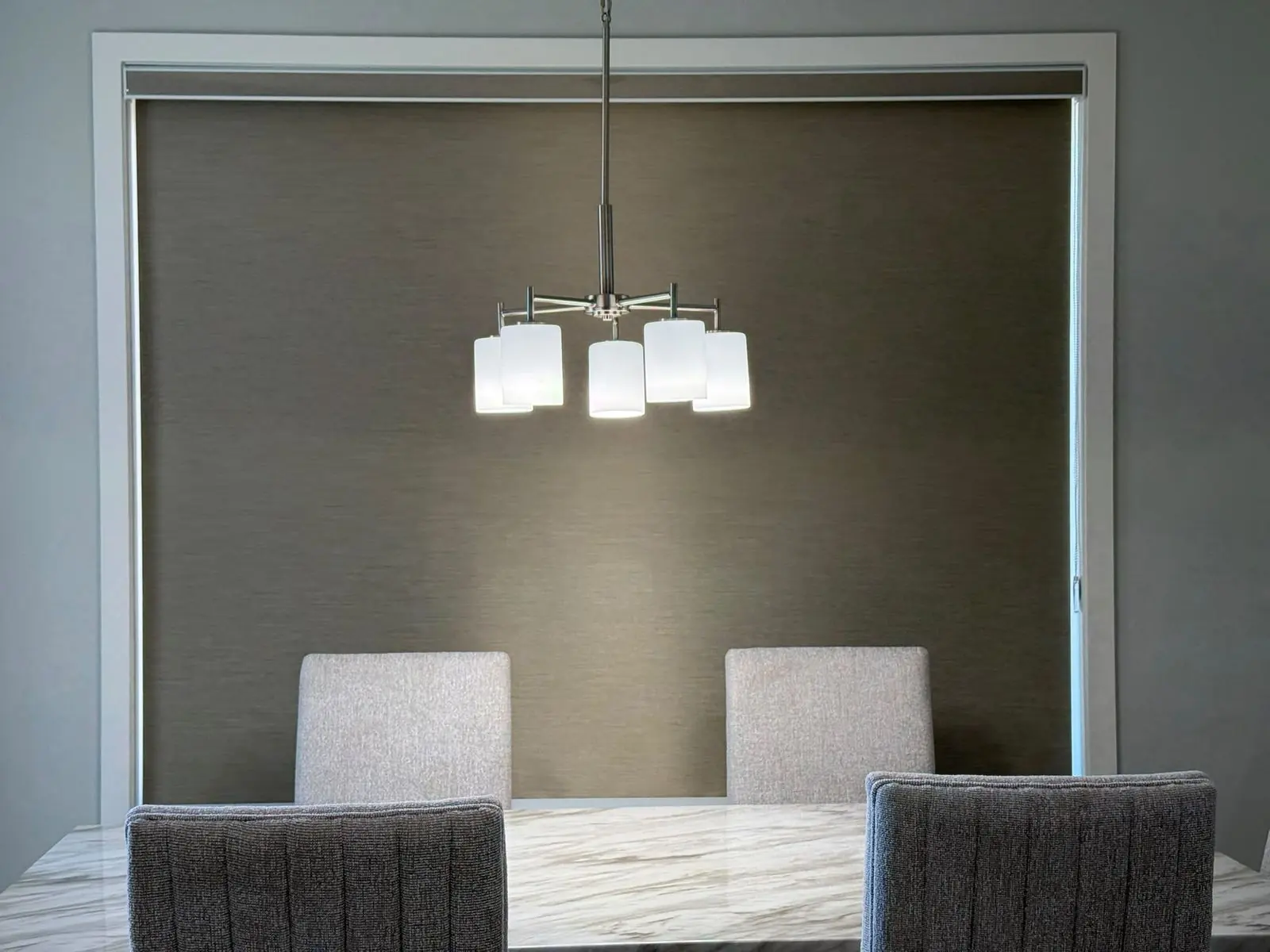 Smart app controlled blackout blind in a Winnipeg dining room