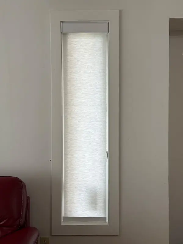 Roller shade on a narrow office window in Winnipeg