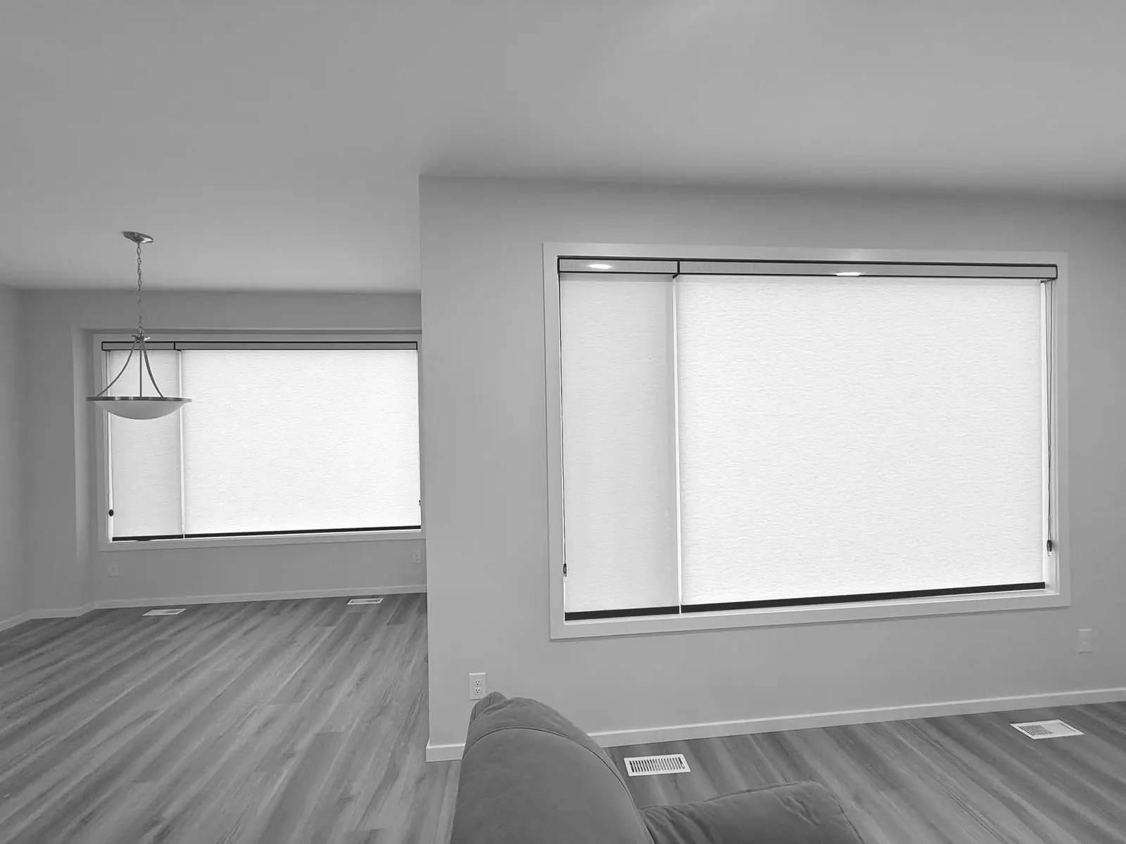 Roller blinds installed in an open concept Winnipeg living space