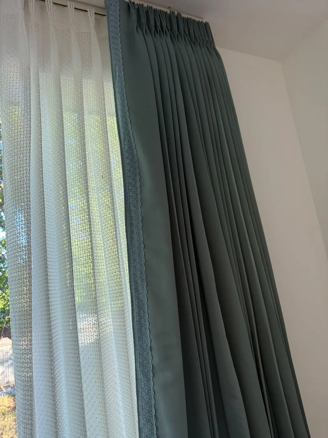 Sheer shades layered with drapery in a Winnipeg home