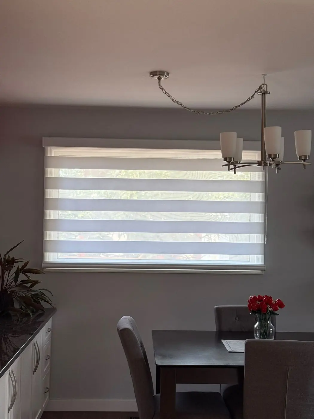 Custom zebra blinds installed in a Winnipeg dining room by Bay Blinds Canada