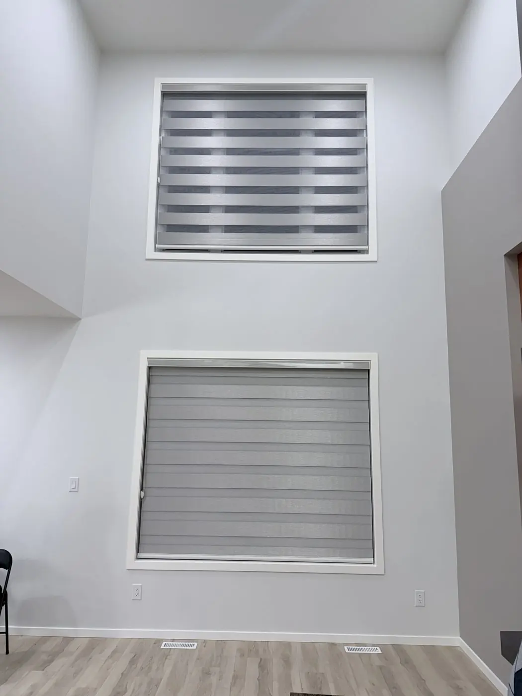 Custom zebra blinds on a two storey window in a Winnipeg home